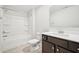 A bathroom features a combination shower and tub, modern vanity and a neutral color scheme at 254 Arlie Ln, Lillington, NC 27546