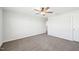 A cozy bedroom features neutral walls, carpeting, and a modern ceiling fan for added comfort at 254 Arlie Ln, Lillington, NC 27546