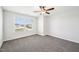 Neutrally-carpeted bedroom with a ceiling fan, window, and wired for wall-mounted television at 254 Arlie Ln, Lillington, NC 27546