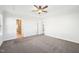 Large bedroom with plush carpeting, ceiling fan, and ample natural light at 254 Arlie Ln, Lillington, NC 27546