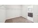 This closet is complete with carpeting, wire shelving, and access to the bathroom space at 254 Arlie Ln, Lillington, NC 27546