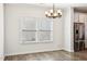 Dining area with modern chandelier and view of the backyard at 254 Arlie Ln, Lillington, NC 27546
