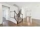 Bright entryway featuring wood floors, staircase and an open floorplan at 254 Arlie Ln, Lillington, NC 27546