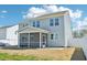 Exterior of house featuring backyard, screened in patio and gray vinyl siding at 254 Arlie Ln, Lillington, NC 27546