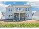 Back exterior of a home featuring screened-in porch and vinyl siding at 254 Arlie Ln, Lillington, NC 27546
