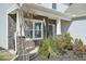 Front entrance to home with stone finish and light colored siding at 254 Arlie Ln, Lillington, NC 27546