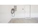 Spacious garage interior showing an EV charger and a door to the interior of the house at 254 Arlie Ln, Lillington, NC 27546