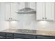 Kitchen features granite countertops, stainless hood, and subway tile backsplash at 254 Arlie Ln, Lillington, NC 27546
