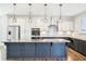 Stunning island kitchen with granite countertops and stainless steel appliances at 254 Arlie Ln, Lillington, NC 27546