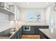 Modern kitchen with stainless steel appliances, granite countertops, and stylish cabinetry at 254 Arlie Ln, Lillington, NC 27546
