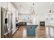 Open kitchen with stainless steel appliances and center island at 254 Arlie Ln, Lillington, NC 27546