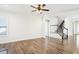 Spacious living room with wood floors and staircase at 254 Arlie Ln, Lillington, NC 27546