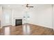 Spacious living room features a cozy fireplace, ample natural light, and hardwood floors at 254 Arlie Ln, Lillington, NC 27546