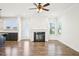 Bright living room with fireplace, hardwood floors, and large windows at 254 Arlie Ln, Lillington, NC 27546