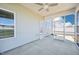 View of covered and screened in patio and exterior wall with window at 254 Arlie Ln, Lillington, NC 27546