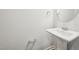 This cozy powder room features a pedestal sink and classic fixtures, creating a clean and functional space at 254 Arlie Ln, Lillington, NC 27546