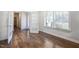 Open room with hardwood style floors, and a bright window at 254 Arlie Ln, Lillington, NC 27546