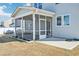 The covered and screened porch offers access to the backyard and lush lawn at 254 Arlie Ln, Lillington, NC 27546