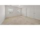 This bedroom has neutral carpeting, white walls, and windows that let in natural light at 285 Plaza Dr # C, Chapel Hill, NC 27517