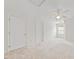 This bedroom has neutral carpeting, white walls, and is equipped with a ceiling fan at 285 Plaza Dr # C, Chapel Hill, NC 27517