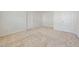 This bedroom has neutral carpeting, white walls, and is equipped with multiple closets at 285 Plaza Dr # C, Chapel Hill, NC 27517