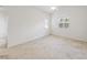Cozy bedroom with soft carpet and dual windows at 285 Plaza Dr # C, Chapel Hill, NC 27517
