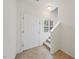 Bright entryway features a white door and carpeted stairs at 285 Plaza Dr # C, Chapel Hill, NC 27517