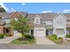 Exterior view of townhomes showing well-maintained landscaping, private entrances, and attached garages at 285 Plaza Dr # C, Chapel Hill, NC 27517