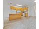 Open floor plan with island counter and white appliances at 285 Plaza Dr # C, Chapel Hill, NC 27517