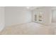 Spacious living room with carpet flooring and glass patio doors at 285 Plaza Dr # C, Chapel Hill, NC 27517