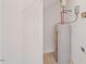 Utility room featuring essential home systems, neutral walls, and practical layout at 285 Plaza Dr # C, Chapel Hill, NC 27517