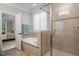 Well-appointed bathroom with a separate glass shower, bathtub, and tile accents at 286 Harrison Pond Dr, Pittsboro, NC 27312