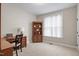 Bedroom featuring a desk, built in bookshelves and a large sunlit window at 286 Harrison Pond Dr, Pittsboro, NC 27312