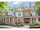 Charming stone and siding home featuring manicured landscaping and a welcoming front porch at 286 Harrison Pond Dr, Pittsboro, NC 27312