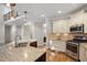 Kitchen with stainless steel appliances, granite countertops, custom cabinets, and hardwood floors at 286 Harrison Pond Dr, Pittsboro, NC 27312