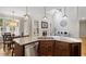 Bright living room with a fireplace, large windows, and stylish decor and high ceilings at 286 Harrison Pond Dr, Pittsboro, NC 27312