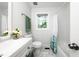 Fresh bathroom with white subway tile, modern fixtures, and a bright window at 2968 Tram Rd, Fuquay Varina, NC 27526