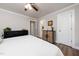 Clean, light-filled bedroom showing two closets with view to an en suite bathroom at 2968 Tram Rd, Fuquay Varina, NC 27526