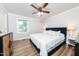 Calm, light-filled main bedroom featuring wood floors, neutral walls, and minimalist decor at 2968 Tram Rd, Fuquay Varina, NC 27526