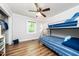 This bedroom offers a twin over twin bunk, light-filled space with hardwood floors, and simple elegance at 2968 Tram Rd, Fuquay Varina, NC 27526