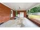 Wide, open carport, built of brick with a white painted ceiling, and views to the landscape at 2968 Tram Rd, Fuquay Varina, NC 27526