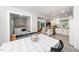 Open concept dining room showcases the view into the kitchen, living room, and laundry room beyond at 2968 Tram Rd, Fuquay Varina, NC 27526
