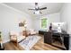 Bright home office with a modern desk setup, sleek wood floors, and stylish neutral decor at 2968 Tram Rd, Fuquay Varina, NC 27526