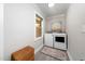 Bright laundry room features new washer and dryer, natural light from window, and herringbone tiled floor at 2968 Tram Rd, Fuquay Varina, NC 27526