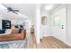 Bright living room with modern flooring, opening to kitchen and updated features at 2968 Tram Rd, Fuquay Varina, NC 27526