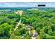 Aerial view of home at 2975 Carolyn Dr, Durham, NC, surrounded by lush greenery and a view of Durham at 2975 Carolyn Dr, Durham, NC 27703