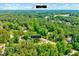 An aerial view of the property with lush surroundings, located at 2975 Carolyn Dr, Durham, NC at 2975 Carolyn Dr, Durham, NC 27703