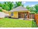 Charming backyard with lawn, patio, and screened porch perfect for outdoor relaxation and entertainment at 2975 Carolyn Dr, Durham, NC 27703