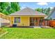 Charming backyard with lawn, patio, and screened porch perfect for outdoor relaxation and entertainment at 2975 Carolyn Dr, Durham, NC 27703