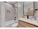 Well-lit bathroom featuring a single vanity, subway tile, and modern fixtures at 2975 Carolyn Dr, Durham, NC 27703
